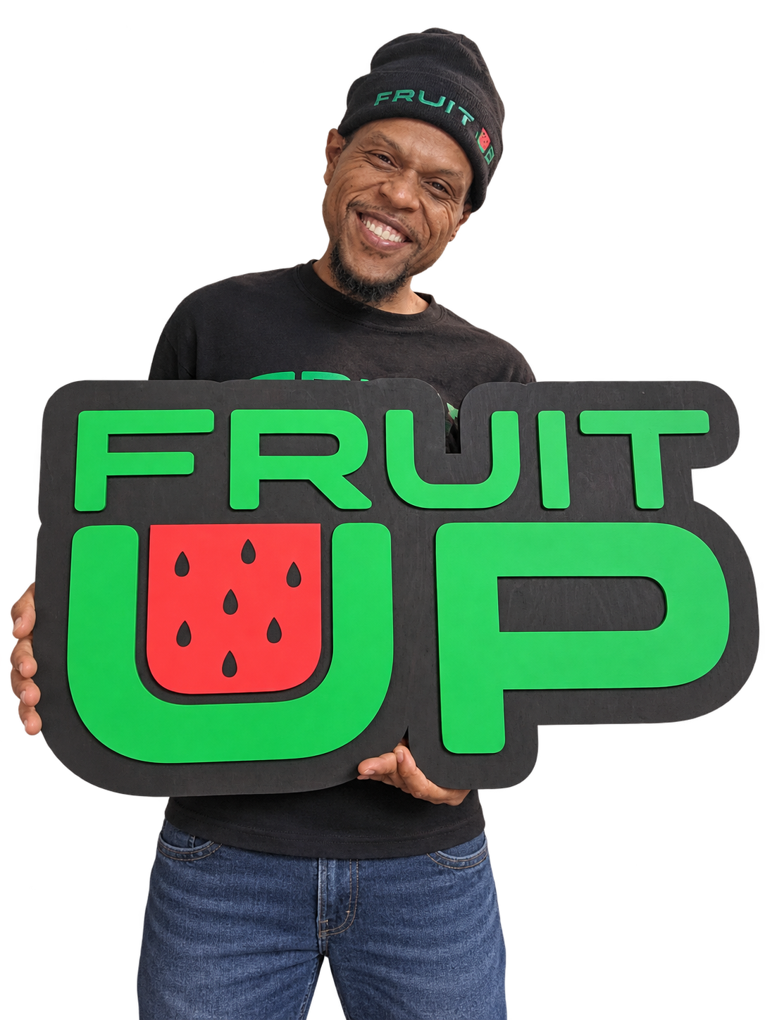 Bobby Smith smiling and holding the original green and red Fruit Up sign